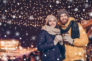 couple in the snow at The Bentleyville Tour of Lights