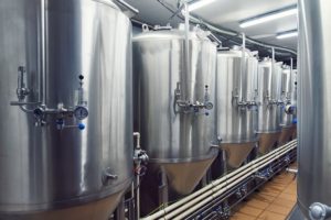 brewery tours with lines of metal tanks
