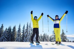 Smiling Couple Of Skiers on Mountain top on Spirit Mountain Duluth