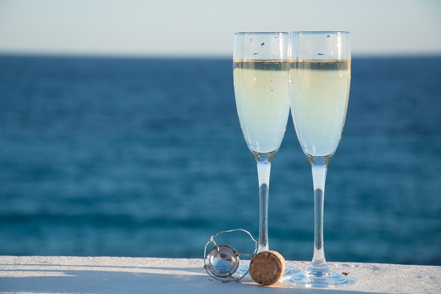 Two glasses with champagne with view of Lake Superior during a Bed and Breakfast Duluth MN stay