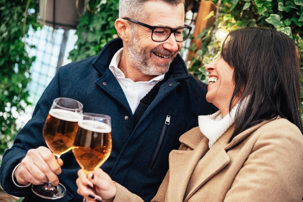 Check out the local Duluth bars for cockails, cider tastings, and craft beer. happy couple enjoying a drink together 