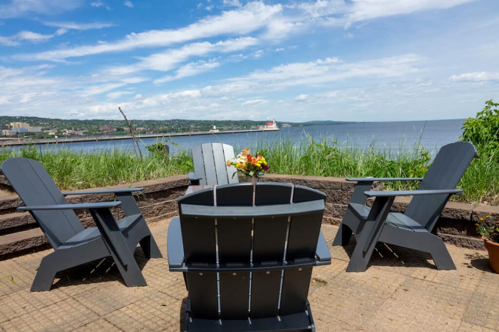 Bed and Breakfast in Duluth, photo of our waterfront area with chairs and fire pit looking out onto Lake Superior