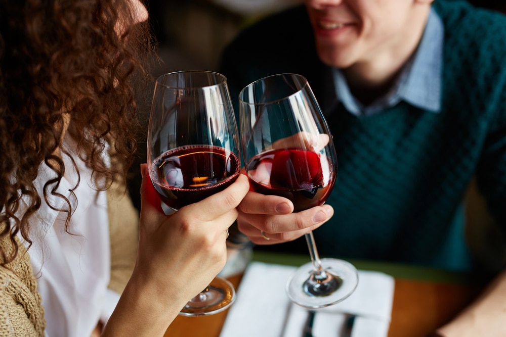 Canal Park Restaurants, photo of a happy couple enjoying a glass of red wine in Duluth