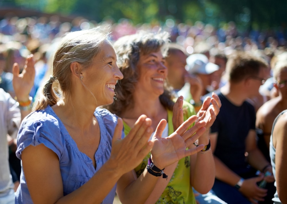 Each year, Canal Park comes alive with music, and one of our favorite annual events is the iconic Bayfront Blues Festival. Photo of two women enjoying the show