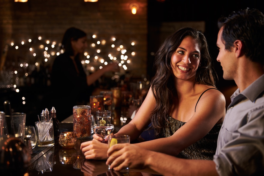 Cozy Bars in Duluth for a Nightcap near our bed and breakfast, photo of a happy couple enjoying a cocktail 